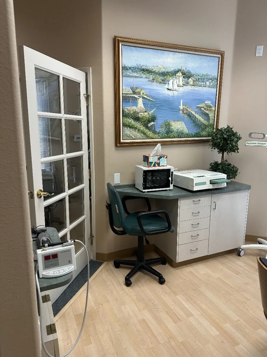 Operatory room with dental chair and landscape painting
