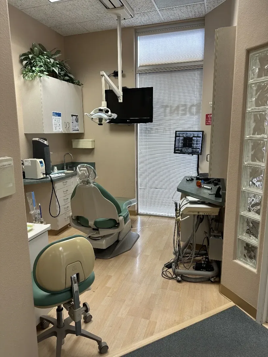 Treatment room with dental equipment and glass block window